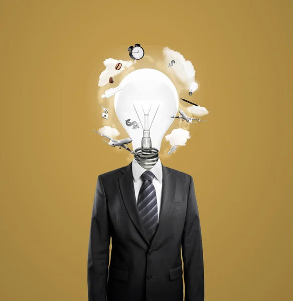 Businessman with lightbulb i — Stock Photo, Image