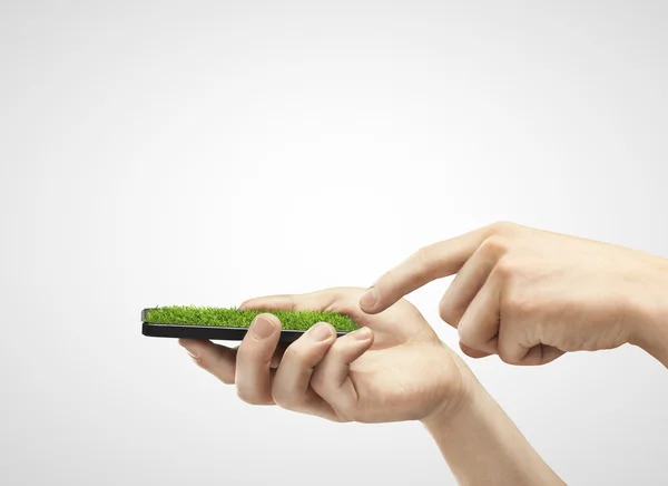 Phone with grass — Stock Photo, Image