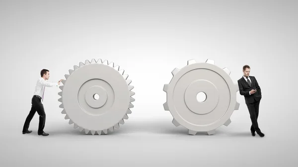 Man duwen een gears — Stockfoto