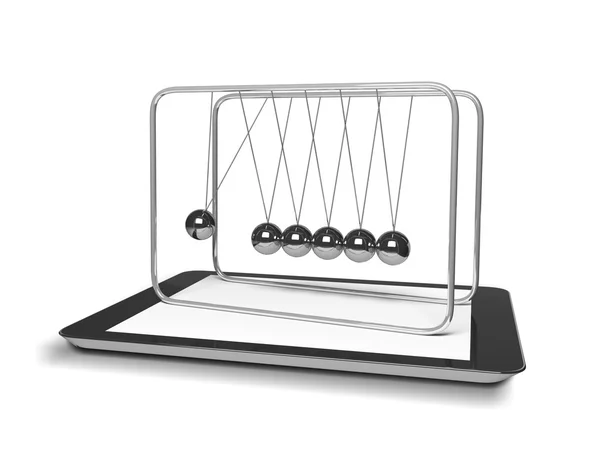 Tablet and newton's cradle — Stock Photo, Image