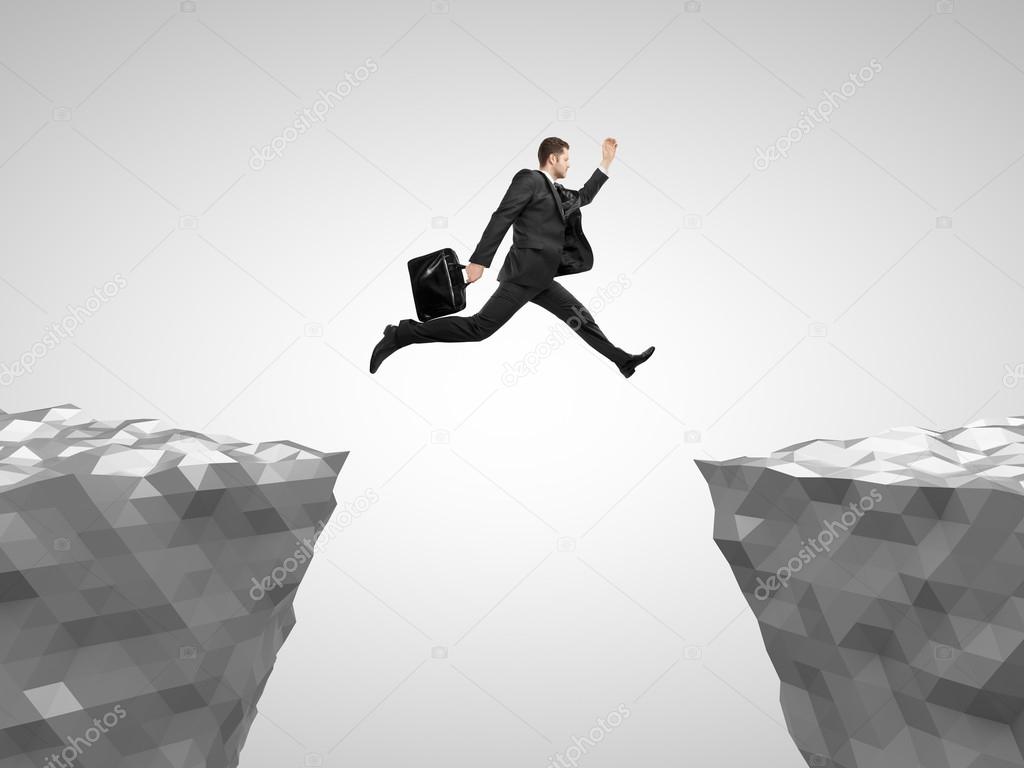 man with briefcase jumping