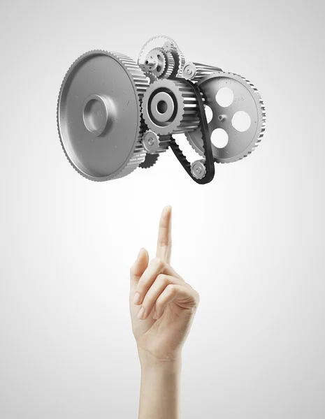 Hand pointing at gears — Stock Photo, Image