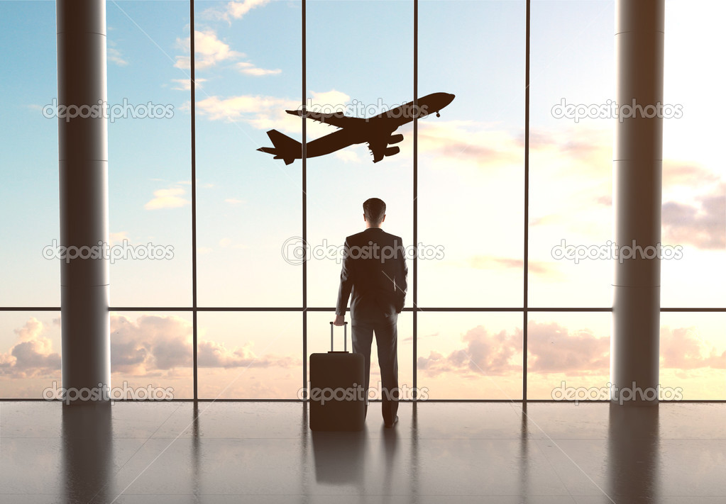 businessman looking in airplane