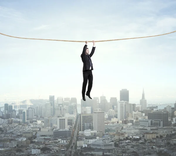 Man climbing on a rope — Stock Photo, Image