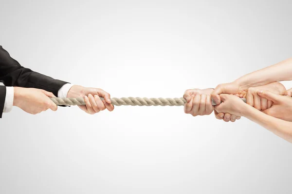 Businessman hanging by a rope — Stock Photo, Image