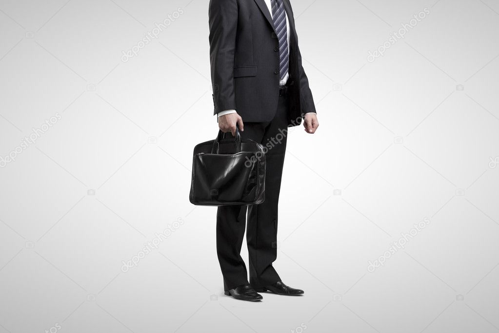 Businessman hanging by a rope