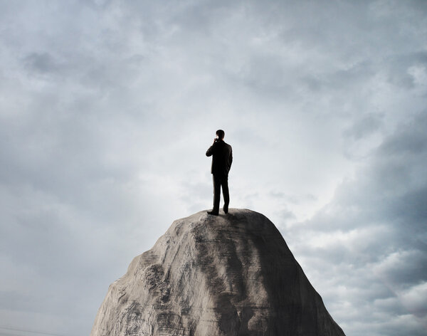 man standing on rock