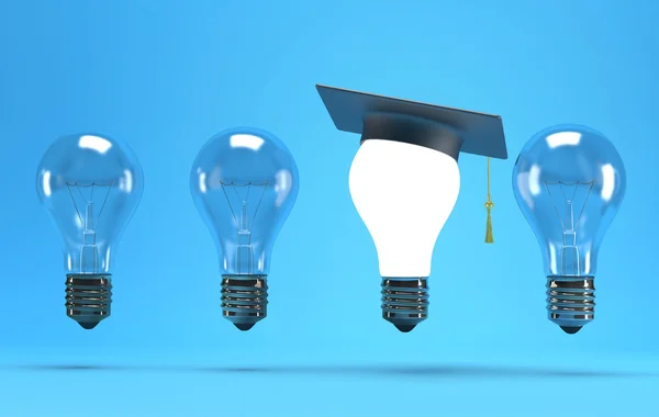 Lightbulb with graduation hat — Stock Photo, Image