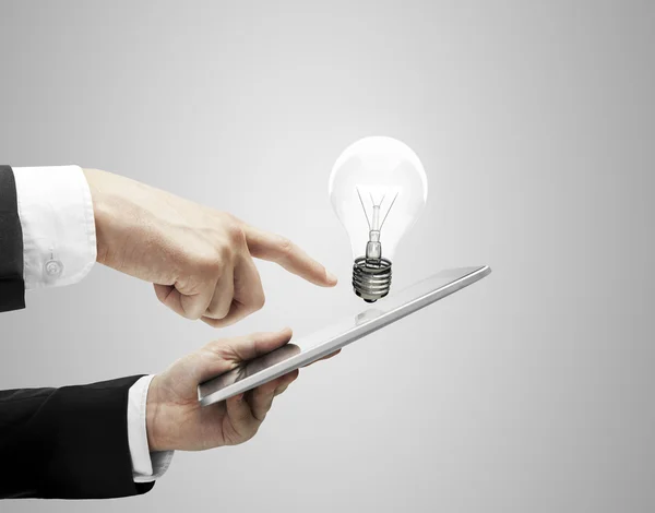 Tablet and lamp — Stock Photo, Image