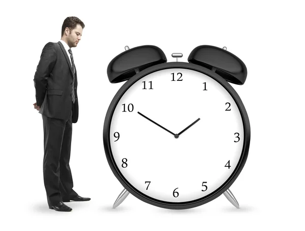 Man looking at clock — Stock Photo, Image