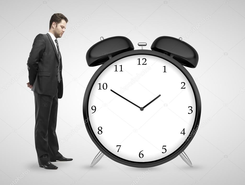 man looking at clock stock photo peshkova 32760813