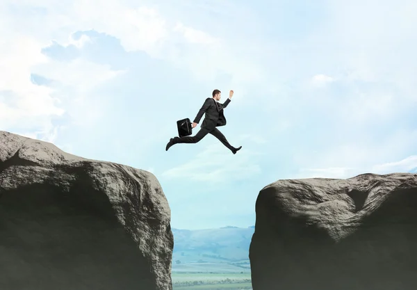 Young businessman jumping — Stock Photo, Image