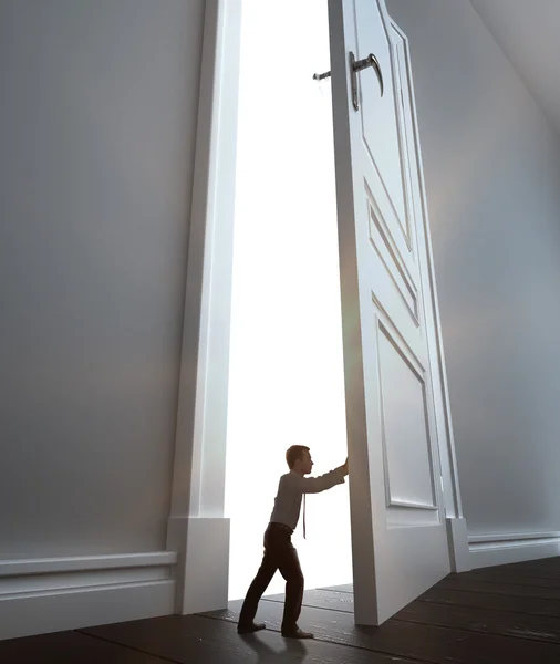 Businessman opens door — Stock Photo, Image