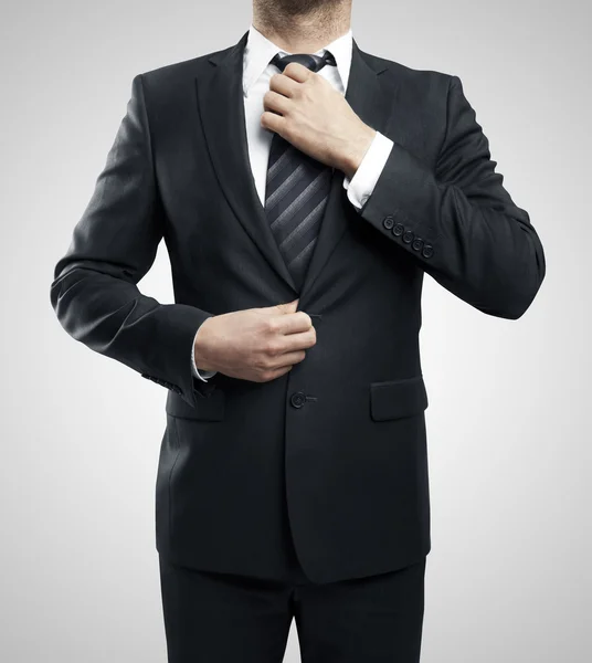 Man adjusts his tie — Stock Photo, Image