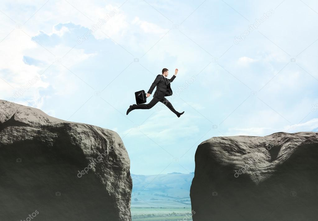 young businessman jumping