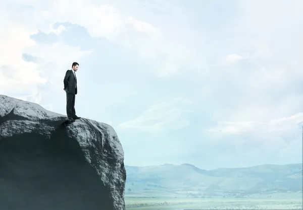 Man standing on rock — Stock Photo, Image