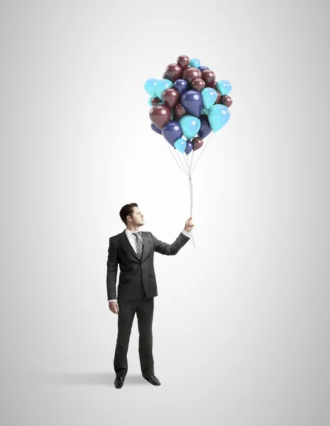Zakenman bedrijf baloons — Stockfoto