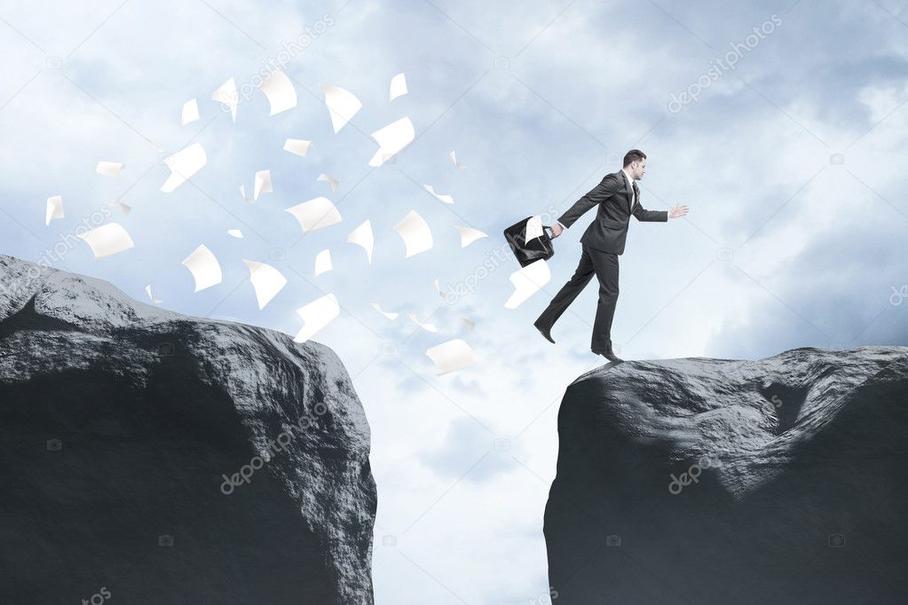 businessman with briefcase jumping