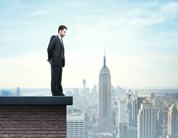 businessman standing on roof