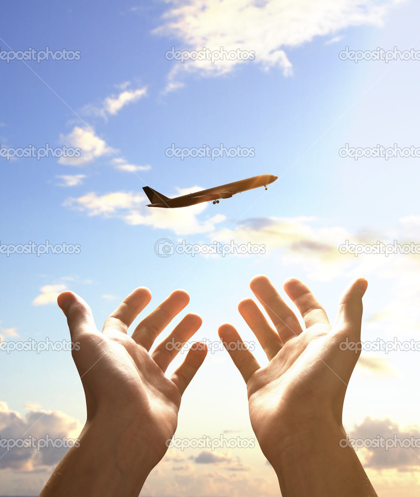hands reach for airplane