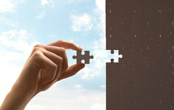 Puzzle on sky background — Stock Photo, Image