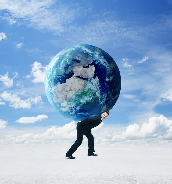 Businessman holding earth — Stock Photo, Image