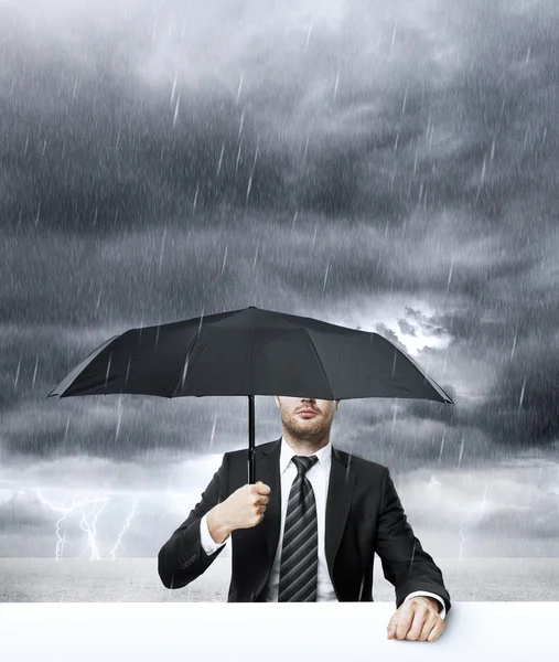 Businessman with umbrella — Stock Photo, Image