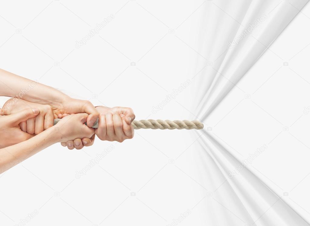 hands pulling rope