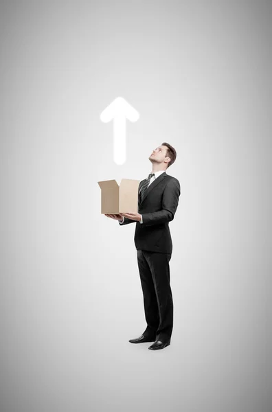 Businessman holding box — Stock Photo, Image