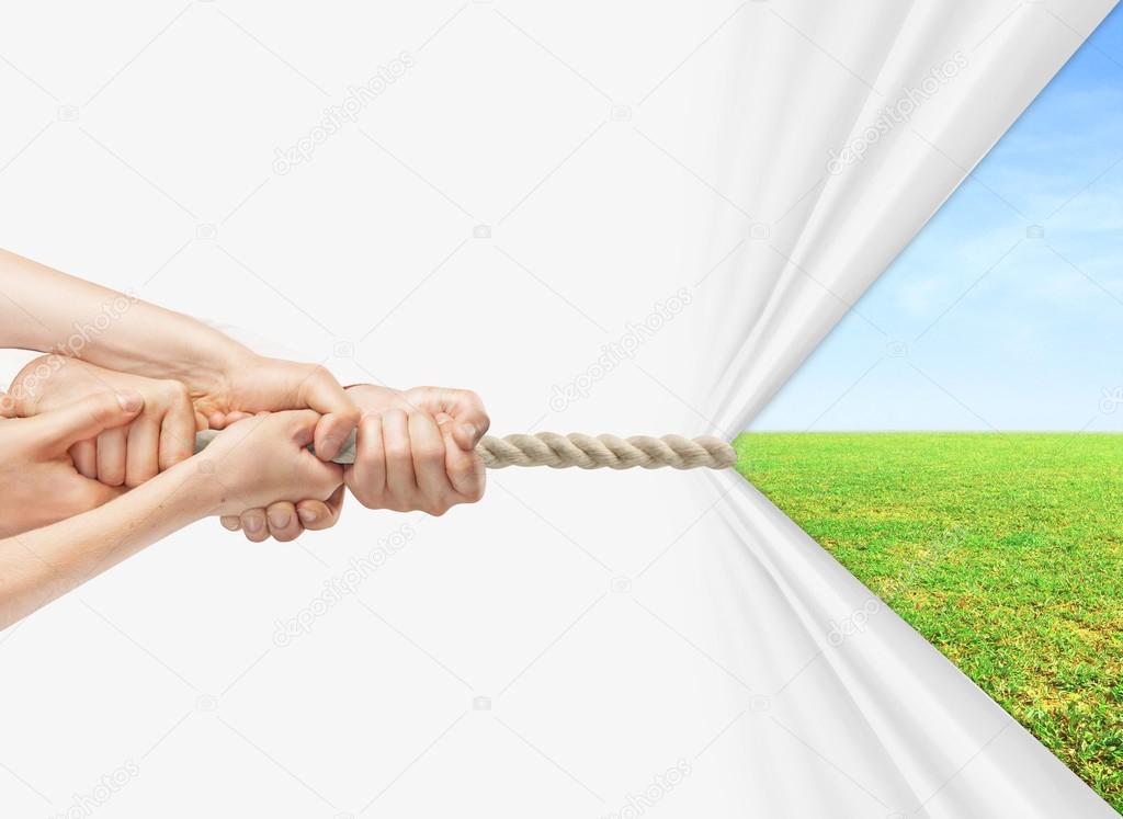 hands pulling rope