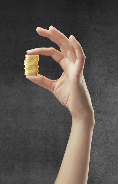 Hand holding gold coins — Stock Photo, Image