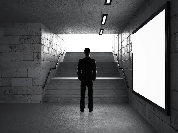 Businessman in underground passage — Stock Photo, Image