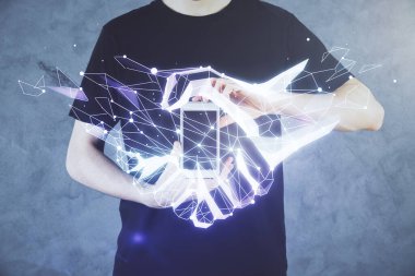 Dijital bir cihaz ve el sıkışma çizimi kullanarak bir adamın ellerini iki kez tutarken görüntülendi. Ortaklık kavramı.