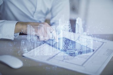 Dijital bir cihaz ve şehir çizimi kullanarak insanın ellerini tutarken çift pozlama.