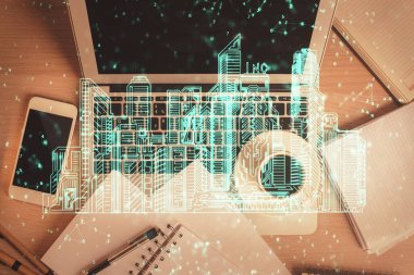 Masaüstü arkaplanındaki bilgisayarın üzerinden şehir çizimi. Üst Manzara. Çifte maruziyet. Akıllı ev kavramı.