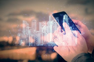 Dijital bir cihaz ve şehir çizimi kullanarak insanın ellerini tutarken çift pozlama.