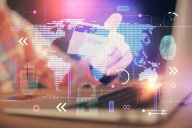Elinde kredi kartı ve dünya haritası çizimi olan bir adamın ellerine iki kez maruz kalmış. Uluslararası İnternet E-ticaret ve teknoloji kavramı.