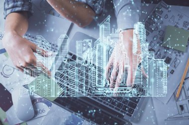 Kadın ve erkeğin birlikte çalıştığı ve binaların hologram çizimlerinin çifte pozlanması. Bilgisayar arkaplanı. Üst Manzara. Akıllı şehir konsepti.