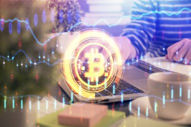 Bilgisayarda ve kripto piyasa temalı hologram çizimlerinde kadın elinin çifte pozu. Engelleme zinciri kavramı.