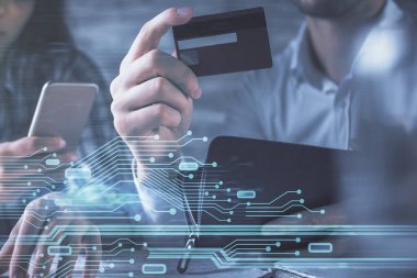 Bir kredi kartı ve veri temalı hologram çizimi tutan kadın ve erkeğin online alışverişine iki kez maruz kalıyorlar. Ai ve E-ticaret çevrimiçi ücret konsepti.