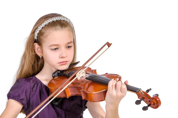 Ung flicka öva fiol. över vit bakgrund Royaltyfria Stockfoton