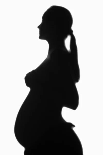 Silueta borrosa de una mujer embarazada — Foto de Stock