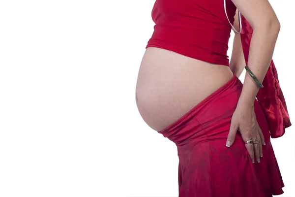 Zwangere vrouw in het rood — Stockfoto