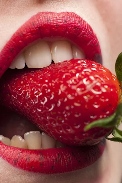 Strawberry in the mouth — Stock Photo, Image