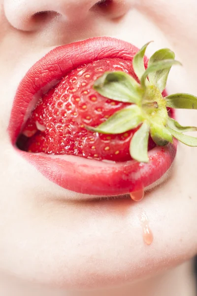 Strawberry in the mouth — Stock Photo, Image