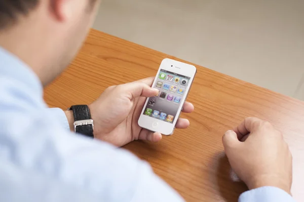 Hand holding Iphone 4 — Stock Photo, Image