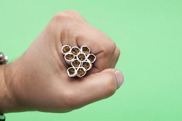 Cigarettes in the human hand — Stock Photo, Image