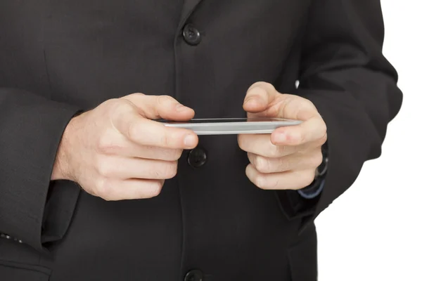 Handsome businessman checking emails on the phone — Stock Photo, Image