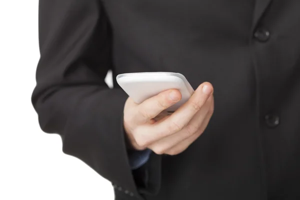 Бизнес-руководитель пишет смс на свой мобильный телефон — стоковое фото