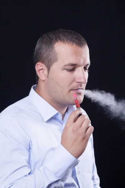 Men smoke an electronic cigarette — Stock Photo, Image